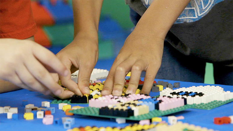 Kids building using LEGO Bricks